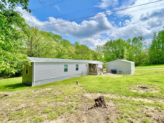 back of property with a lawn
