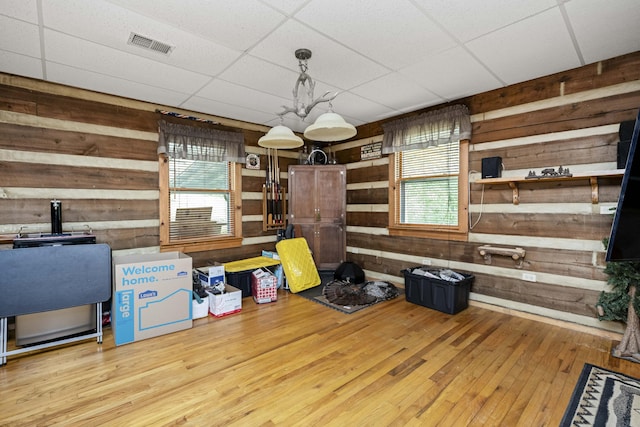 2616 Doylesville Rd, Richmond, KY 40475 - misc room featuring wooden walls, a drop ceiling, hardwood / wood-style flooring, and visible vents