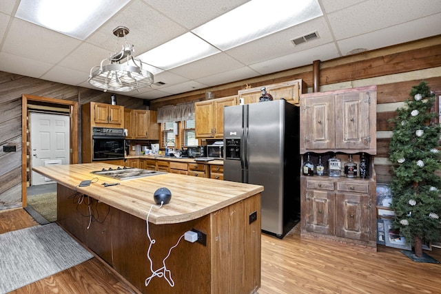 2616 Doylesville Rd, Richmond, KY 40475 - kitchen featuring oven, butcher block countertops, a drop ceiling, stainless steel cooktop, and refrigerator with ice dispenser