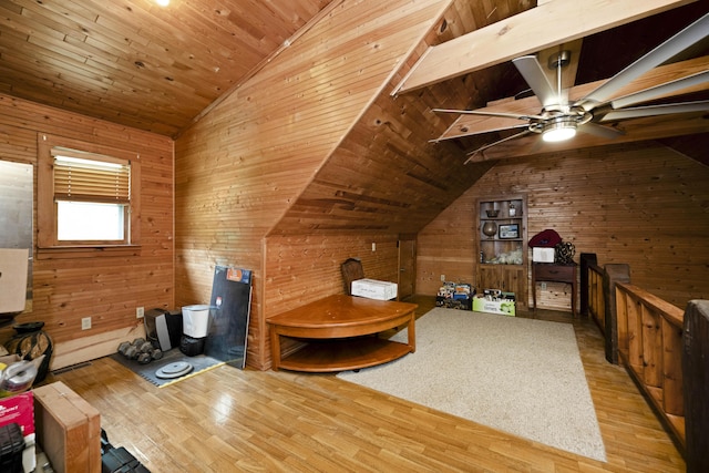 2616 Doylesville Rd, Richmond, KY 40475 - living area featuring wooden walls, a ceiling fan, vaulted ceiling, and wood finished floors