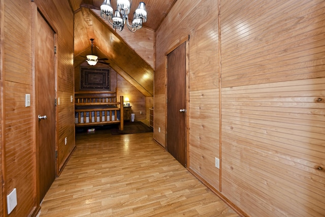 2616 Doylesville Rd, Richmond, KY 40475 - hall featuring wood walls, light wood-style flooring, and a chandelier