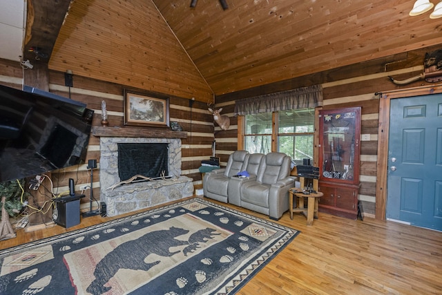2616 Doylesville Rd, Richmond, KY 40475 - living room featuring wooden walls, high vaulted ceiling, a stone fireplace, wooden ceiling, and wood finished floors