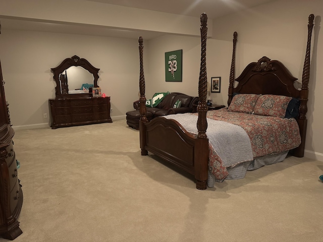 carpeted bedroom featuring baseboards