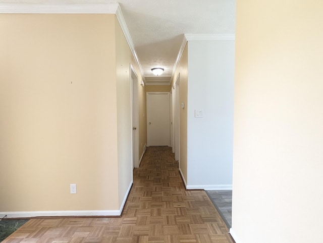 corridor featuring baseboards and ornamental molding