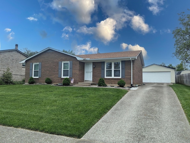 single story home with a detached garage, brick siding, an outdoor structure, and a front lawn