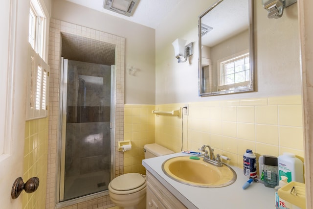 1160 Prather Dr, Nancy, KY 42544 - full bathroom featuring vanity, toilet, tile walls, a wainscoted wall, and a shower stall