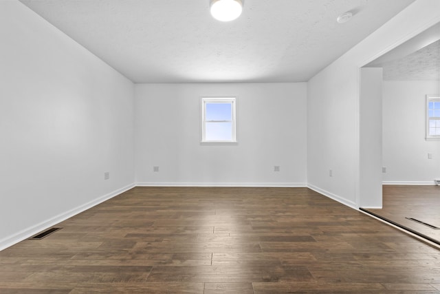 342 Prescott Rd, Paris, KY 40361 - unfurnished room featuring a textured ceiling, baseboards, and dark wood-type flooring