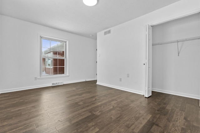 342 Prescott Rd, Paris, KY 40361 - unfurnished bedroom featuring a closet, baseboards, dark wood-type flooring, and visible vents