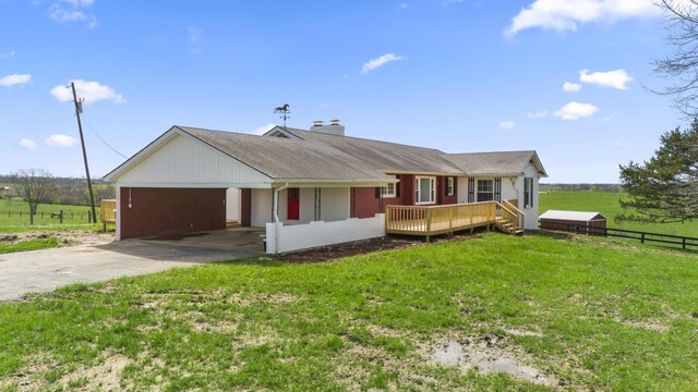 342 Prescott Rd, Paris, KY 40361 - single story home featuring a chimney, a front yard, a deck, fence, and concrete driveway
