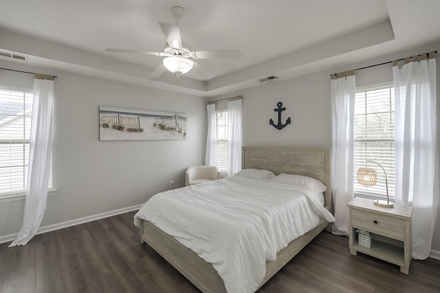 132 Mason Springs Dr, Nicholasville, KY 40356 - bedroom with dark wood finished floors, a tray ceiling, ceiling fan, and baseboards
