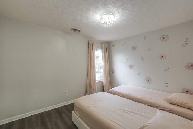 132 Mason Springs Dr, Nicholasville, KY 40356 - bedroom featuring dark wood-style flooring, a textured ceiling, and baseboards