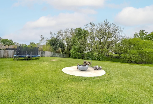 132 Mason Springs Dr, Nicholasville, KY 40356 - view of yard featuring a trampoline and an outdoor fire pit