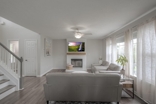 132 Mason Springs Dr, Nicholasville, KY 40356 - living area with ceiling fan, a fireplace, wood finished floors, and baseboards