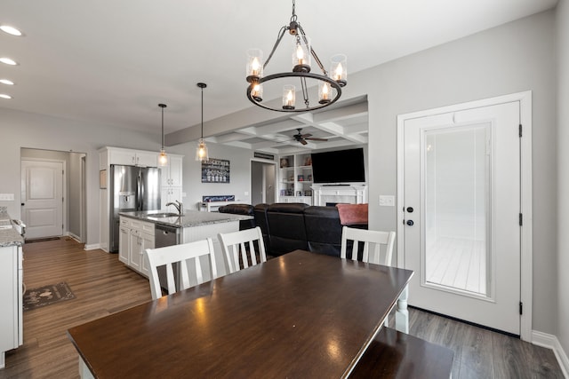 dining space with a fireplace, baseboards, recessed lighting, dark wood finished floors, and ceiling fan with notable chandelier