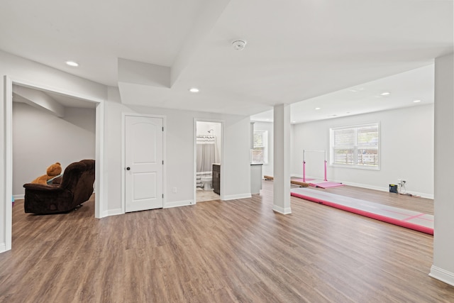below grade area with recessed lighting, baseboards, and wood finished floors