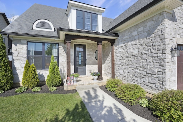 property entrance with covered porch and stone siding