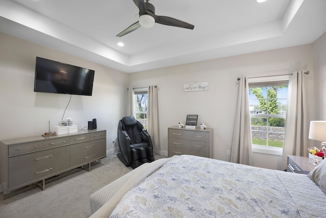 bedroom with a ceiling fan, carpet floors, baseboards, a tray ceiling, and recessed lighting