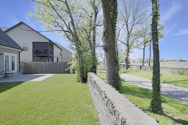 view of yard with a patio and fence
