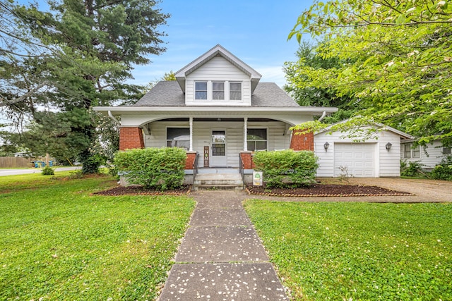 123 Baughman Ave, Danville, KY 40422 - view of front of house with covered porch, an attached garage, driveway, and a front lawn