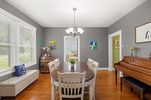 123 Baughman Ave, Danville, KY 40422 - dining area featuring an inviting chandelier, a textured ceiling, and light wood-style flooring