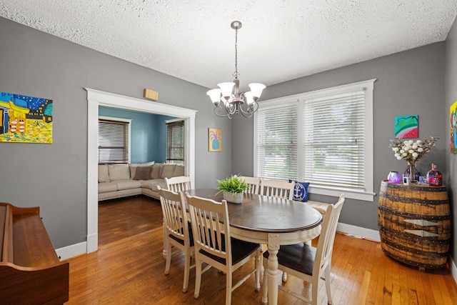 123 Baughman Ave, Danville, KY 40422 - dining area featuring baseboards, wood-type flooring, and a chandelier