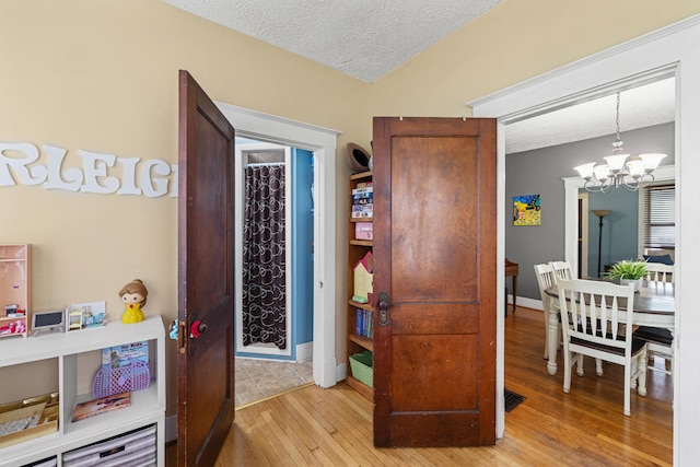 123 Baughman Ave, Danville, KY 40422 - interior space with baseboards, a textured ceiling, a chandelier, and hardwood / wood-style flooring