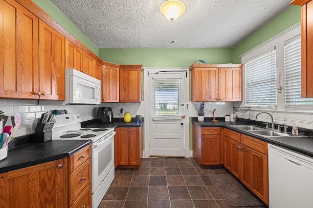 123 Baughman Ave, Danville, KY 40422 - kitchen with backsplash, a textured ceiling, dark countertops, a sink, and white appliances