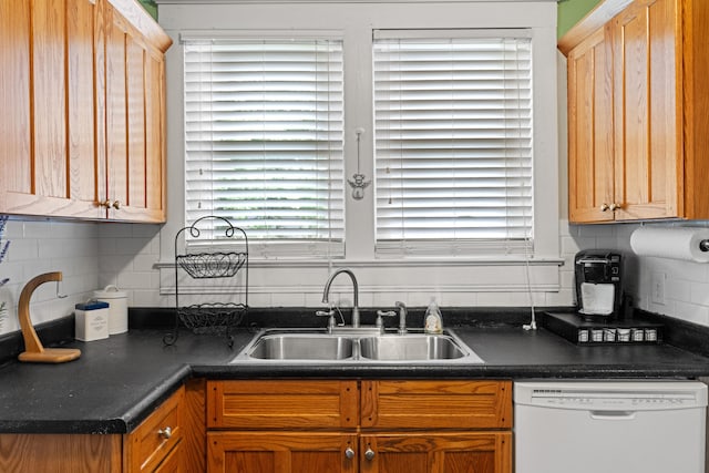 123 Baughman Ave, Danville, KY 40422 - kitchen with white dishwasher, dark countertops, tasteful backsplash, and a sink