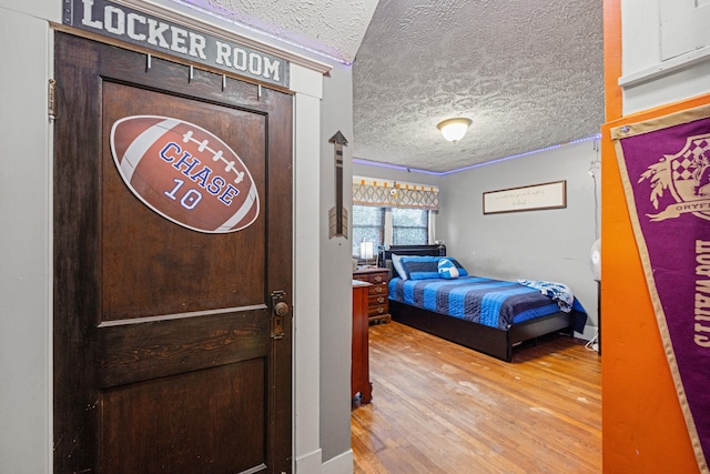 123 Baughman Ave, Danville, KY 40422 - bedroom featuring a textured ceiling and wood finished floors
