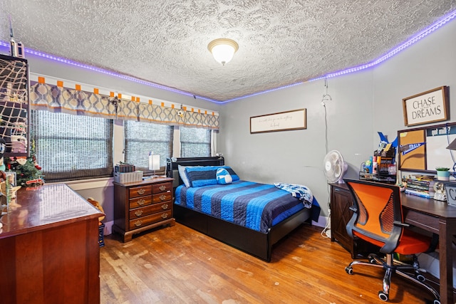 123 Baughman Ave, Danville, KY 40422 - bedroom with a textured ceiling and wood finished floors