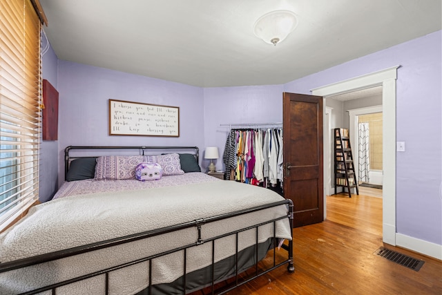 123 Baughman Ave, Danville, KY 40422 - bedroom featuring baseboards, visible vents, multiple windows, and wood finished floors