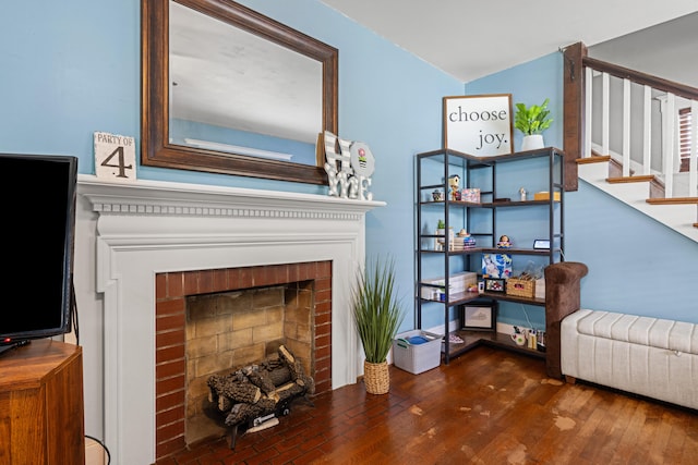 123 Baughman Ave, Danville, KY 40422 - living room with stairs, a brick fireplace, and wood finished floors
