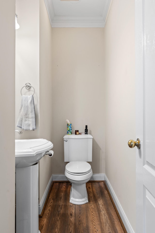 963 Star Shoot Pkwy, Lexington, KY 40509 - bathroom featuring crown molding, baseboards, wood finished floors, and toilet