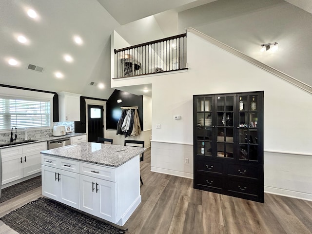 11 Marco Island Dr, Somerset, KY 42503 - kitchen featuring a sink, stainless steel dishwasher, wood finished floors, a kitchen island, and white cabinetry