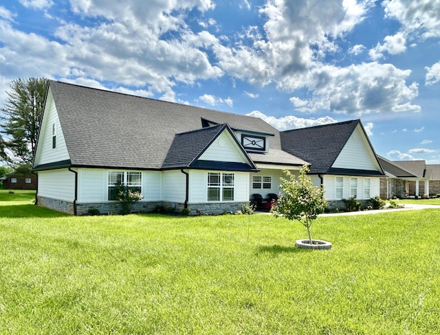 11 Marco Island Dr, Somerset, KY 42503 - view of front facade featuring a front yard, a shingled roof, and stone siding