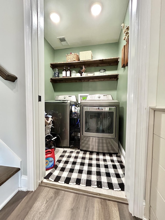 11 Marco Island Dr, Somerset, KY 42503 - clothes washing area with washer and clothes dryer, wood finished floors, and baseboards