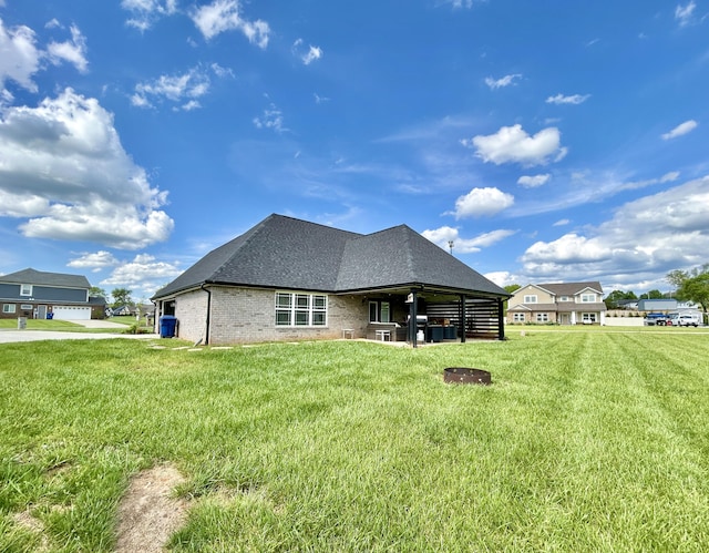 11 Marco Island Dr, Somerset, KY 42503 - back of property with a yard, brick siding, and roof with shingles