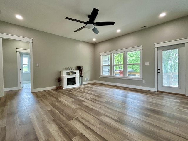 108 Patriot Dr, Science Hill, KY 42553 - unfurnished living room with wood finished floors, ceiling fan, a fireplace, recessed lighting, and baseboards