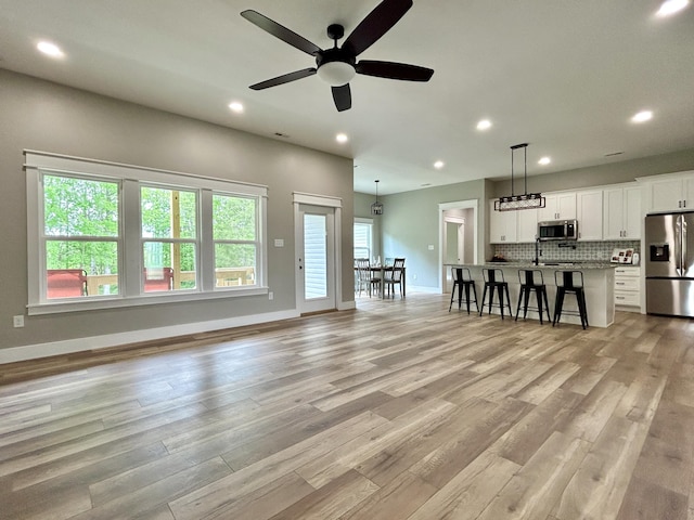 108 Patriot Dr, Science Hill, KY 42553 - living room featuring ceiling fan, light wood-style floors, recessed lighting, and baseboards