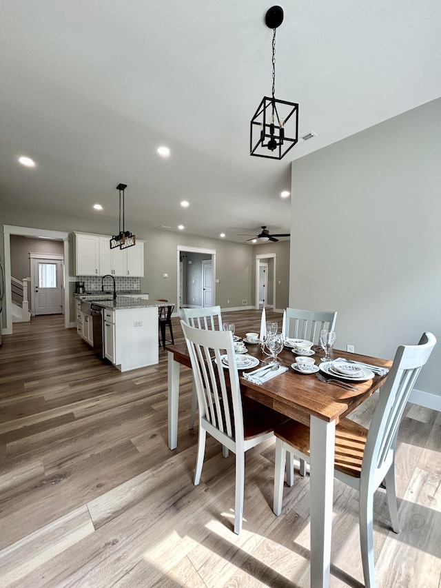 108 Patriot Dr, Science Hill, KY 42553 - dining room featuring light wood finished floors, recessed lighting, a chandelier, ceiling fan, and baseboards