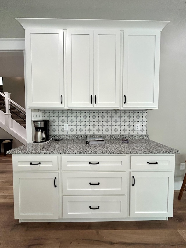 108 Patriot Dr, Science Hill, KY 42553 - bar featuring tasteful backsplash, dark wood-style floors, and stairway