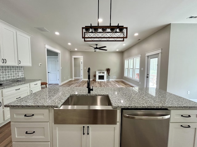 108 Patriot Dr, Science Hill, KY 42553 - kitchen featuring dishwasher, a sink, a ceiling fan, wood finished floors, and recessed lighting