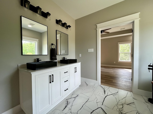 108 Patriot Dr, Science Hill, KY 42553 - full bathroom with healthy amount of natural light, baseboards, double vanity, and marble finish floors