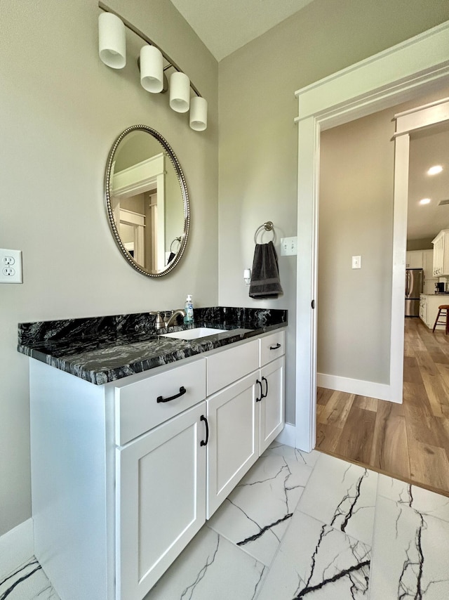 108 Patriot Dr, Science Hill, KY 42553 - bathroom featuring baseboards, marble finish flooring, and vanity