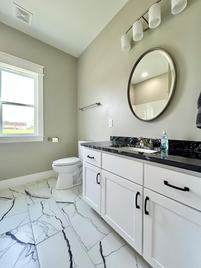 108 Patriot Dr, Science Hill, KY 42553 - bathroom with marble look tile flooring, vanity, toilet, and baseboards