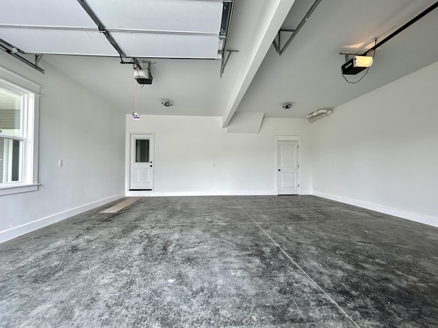 108 Patriot Dr, Science Hill, KY 42553 - garage featuring a garage door opener and baseboards