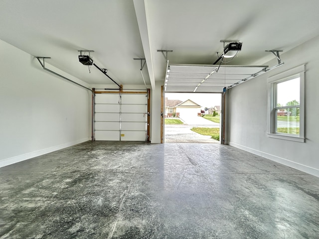 108 Patriot Dr, Science Hill, KY 42553 - garage featuring a garage door opener and baseboards