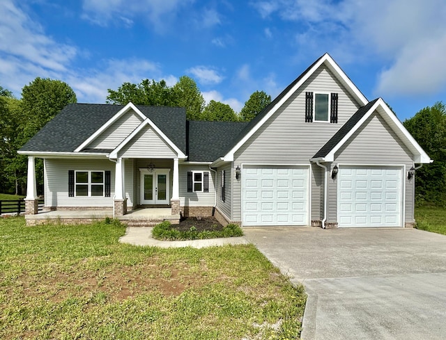108 Patriot Dr, Science Hill, KY 42553 - view of front of property with french doors, driveway, a front yard, and roof with shingles