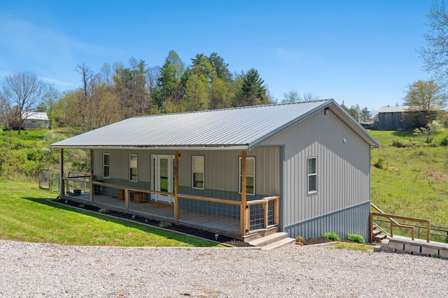 51 Ivy Ln, Wellington, KY 40387 - view of front of home featuring a porch, a front lawn, and metal roof