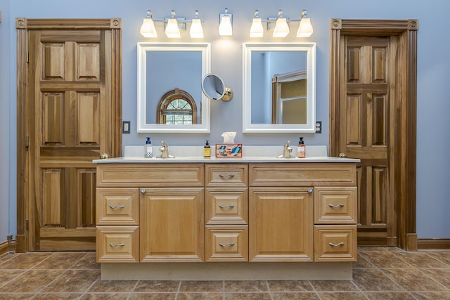 full bathroom featuring double vanity and a sink